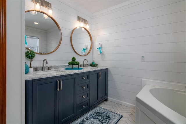 bathroom with vanity and a bathtub