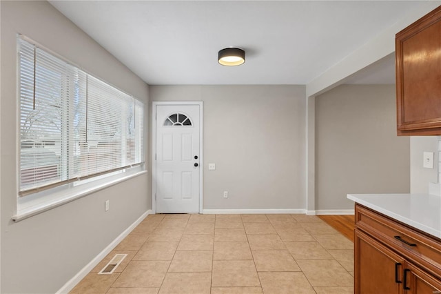 interior space featuring light tile patterned flooring