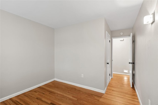 unfurnished room featuring light hardwood / wood-style floors