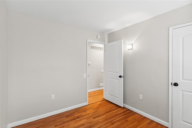 unfurnished bedroom featuring wood-type flooring