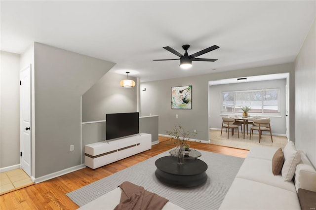 living room with ceiling fan and hardwood / wood-style floors