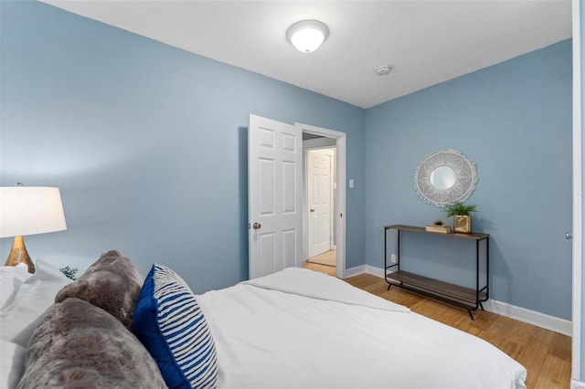 bedroom with hardwood / wood-style floors