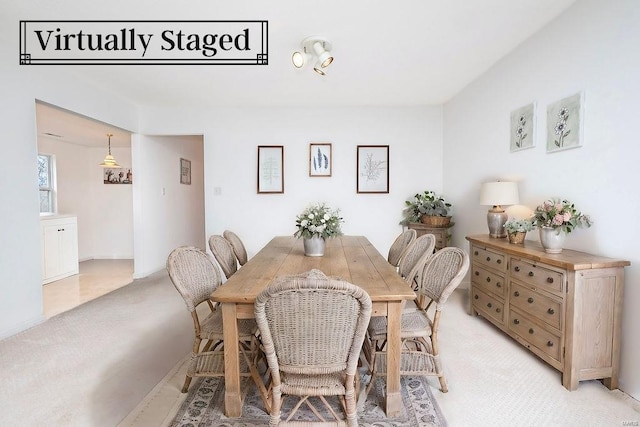 view of carpeted dining area