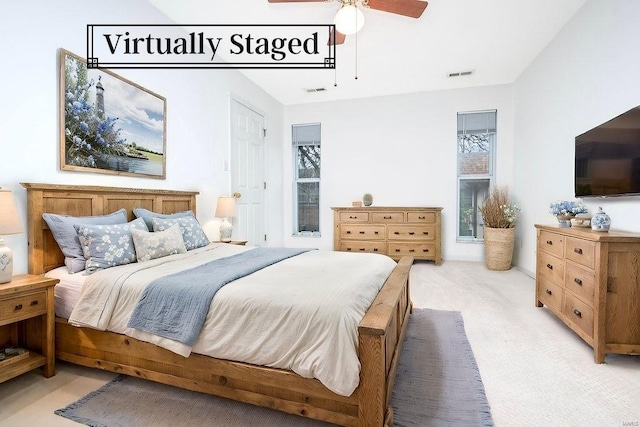 carpeted bedroom featuring ceiling fan