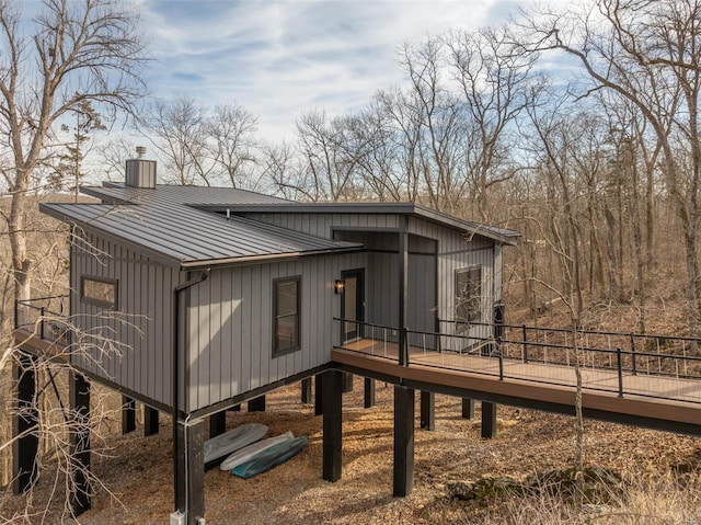 view of property exterior featuring a wooden deck