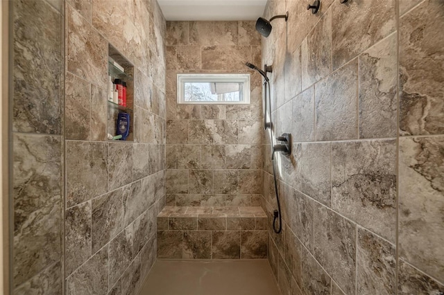 bathroom with a tile shower