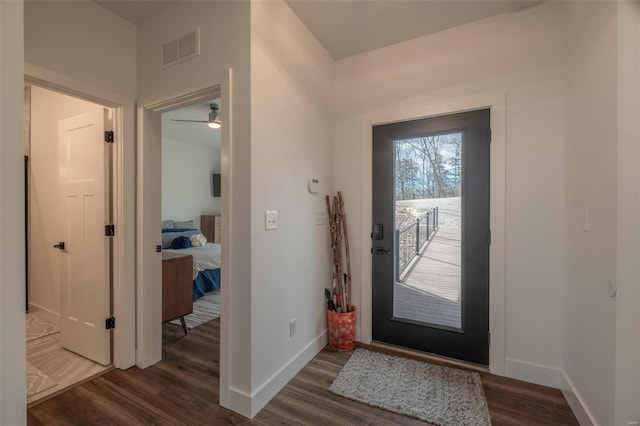 foyer entrance with dark hardwood / wood-style flooring