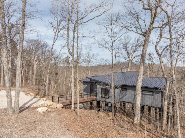 rear view of house with a wooden deck