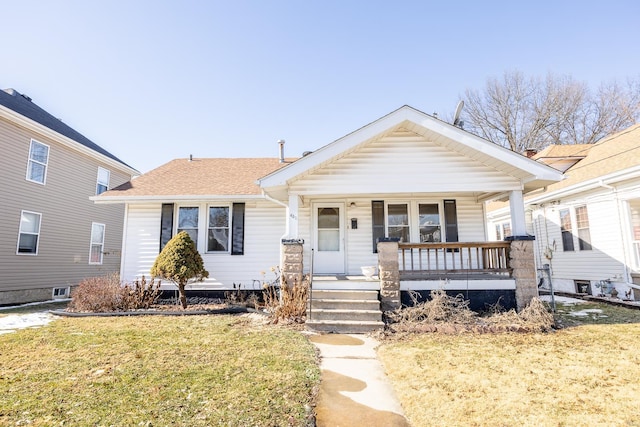 view of front facade featuring a front lawn and a porch