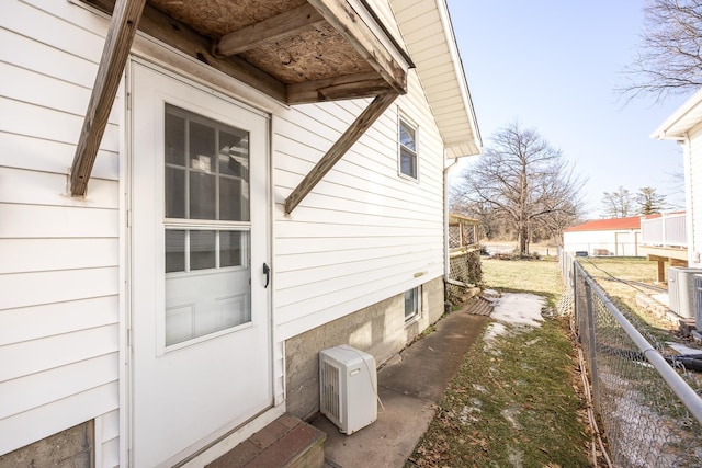 view of side of property with ac unit