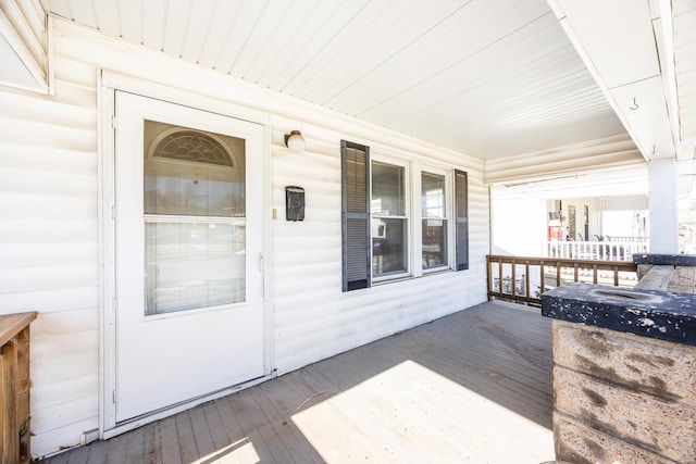 wooden terrace featuring a porch