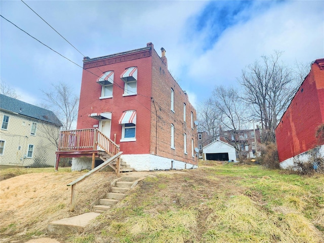 rear view of house featuring a yard