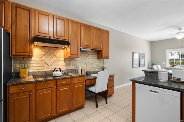 kitchen featuring tasteful backsplash, ceiling fan, dark stone counters, and black appliances