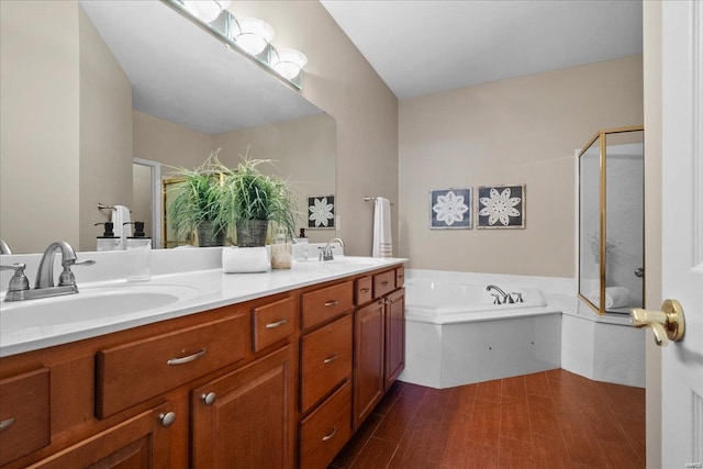 bathroom featuring vanity and separate shower and tub