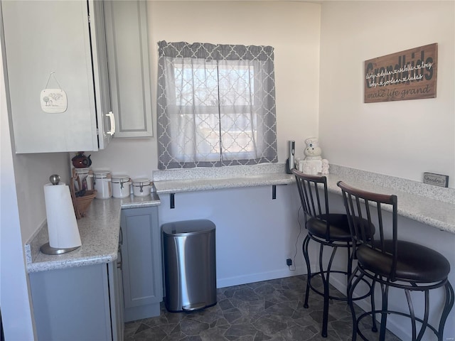 kitchen featuring light stone counters