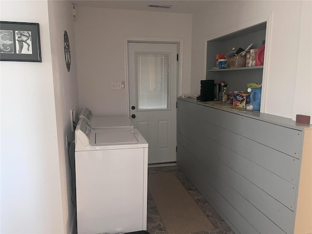 laundry room with separate washer and dryer