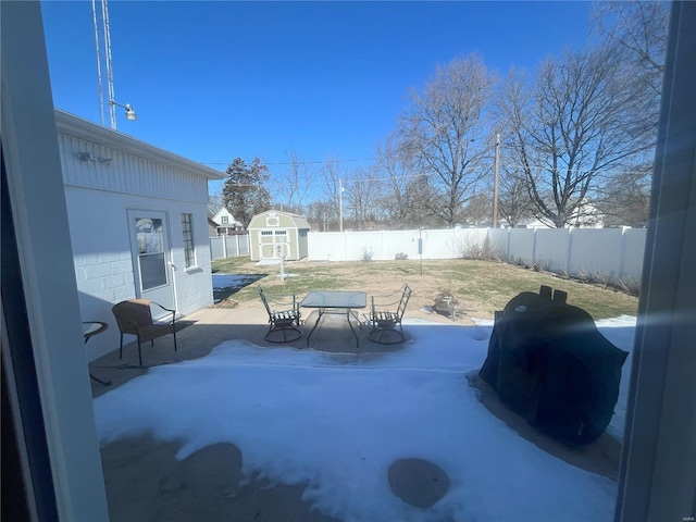 view of swimming pool with a patio and a storage unit