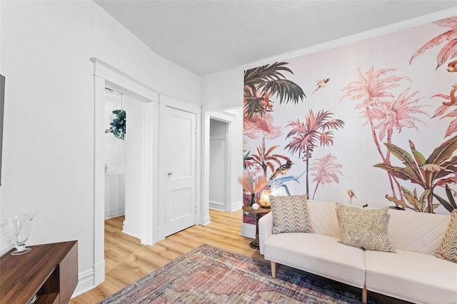 sitting room with wood finished floors and baseboards