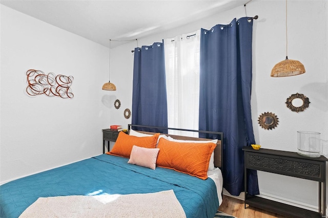 bedroom featuring wood finished floors