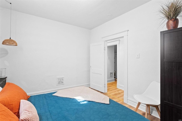 interior space featuring wood finished floors and baseboards