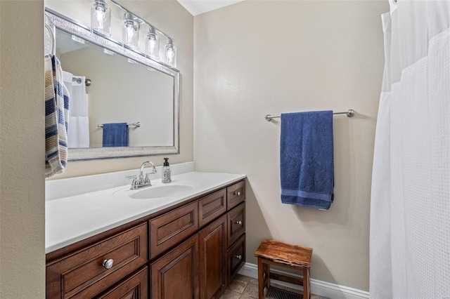 bathroom with vanity and tile patterned flooring