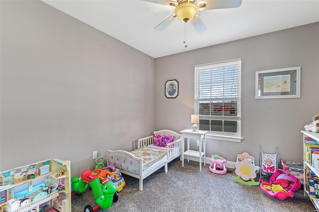 bedroom featuring ceiling fan and carpet