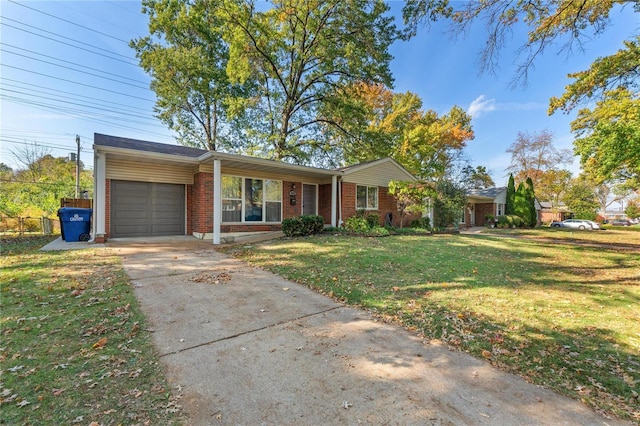 single story home featuring a carport, a garage, and a front yard