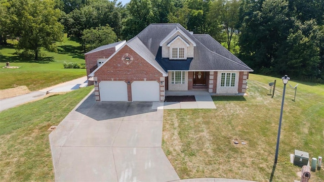 view of front of property featuring a garage and a front yard