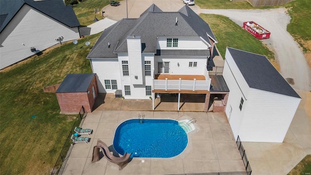 rear view of property featuring a yard