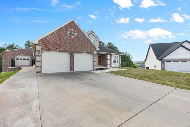 view of front of home featuring a garage and a front yard