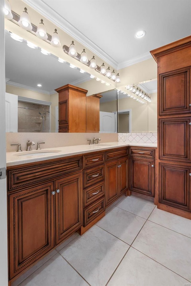 bathroom with crown molding, tile patterned floors, walk in shower, and vanity