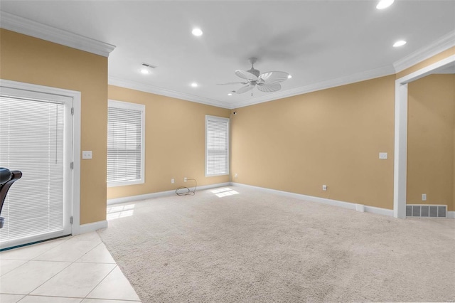 unfurnished living room with crown molding, light carpet, and ceiling fan