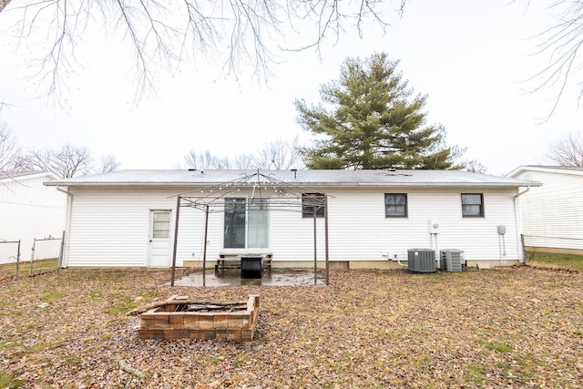 rear view of property with cooling unit and a patio area