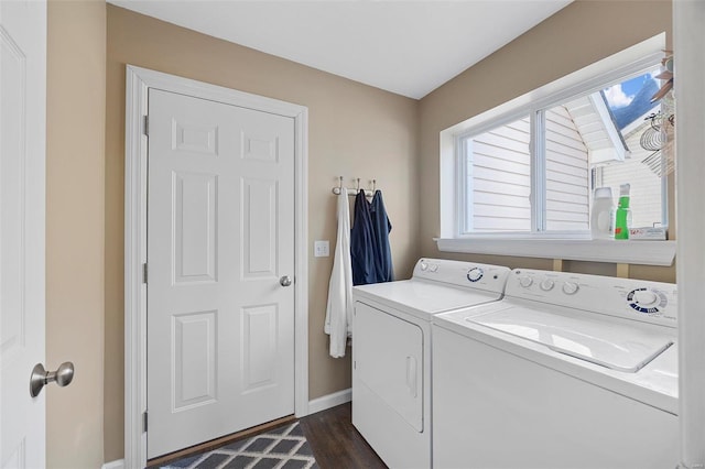 laundry area featuring dark hardwood / wood-style floors and washing machine and dryer