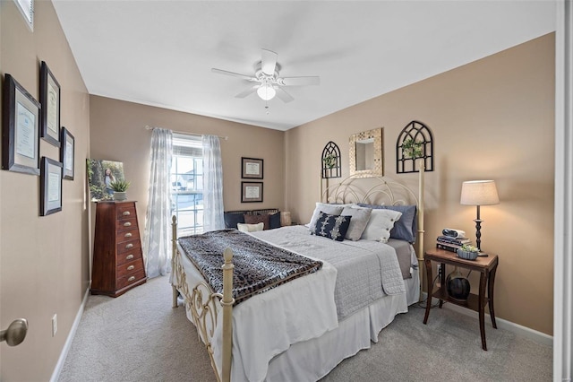 bedroom featuring light carpet and ceiling fan