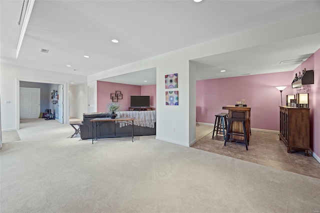 carpeted living room featuring indoor bar