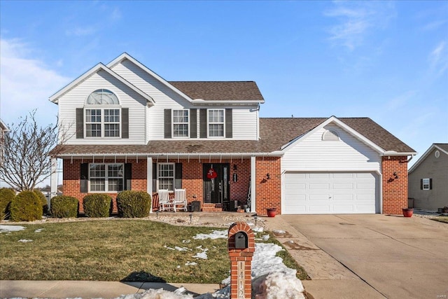 view of front of property featuring a garage, a porch, and a front yard