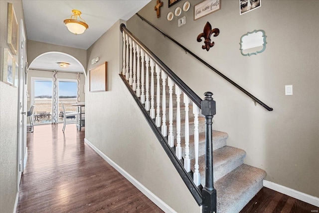 stairs with hardwood / wood-style flooring