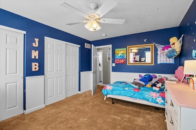 bedroom featuring light colored carpet and ceiling fan