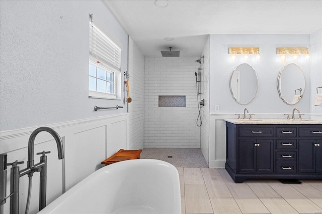 bathroom with vanity and independent shower and bath