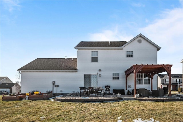 back of property featuring a yard, a pergola, and a patio area