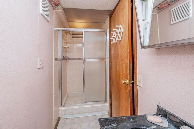 bathroom with a shower with shower door