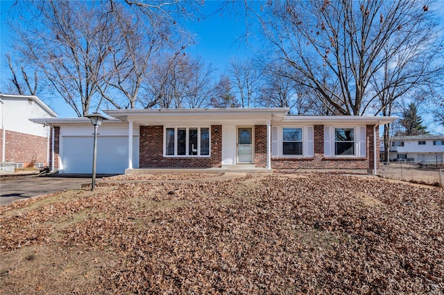 ranch-style home with a garage