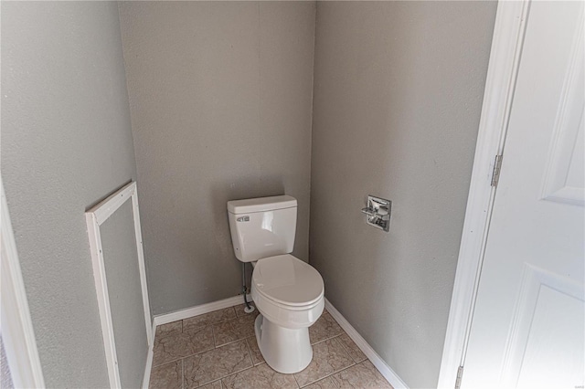 bathroom featuring tile patterned flooring and toilet