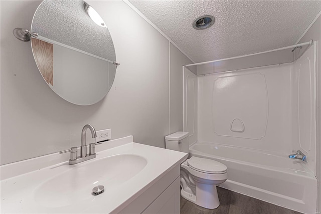 full bathroom with hardwood / wood-style flooring, shower / tub combination, vanity, a textured ceiling, and toilet