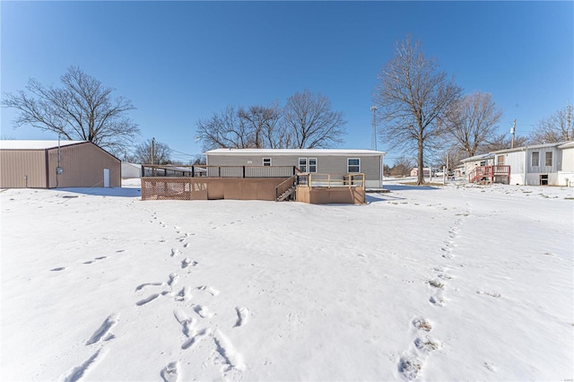 view of snow covered house