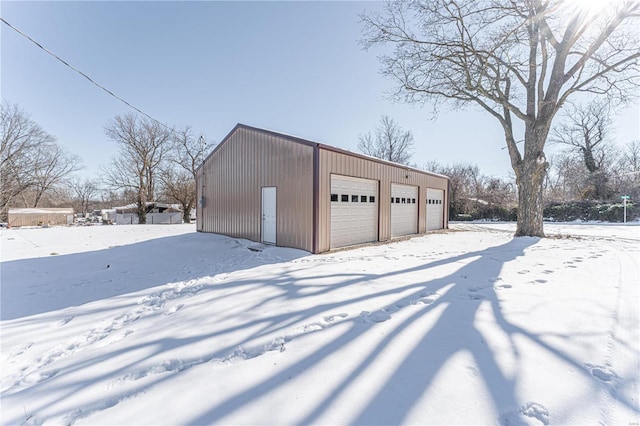 view of snow covered garage