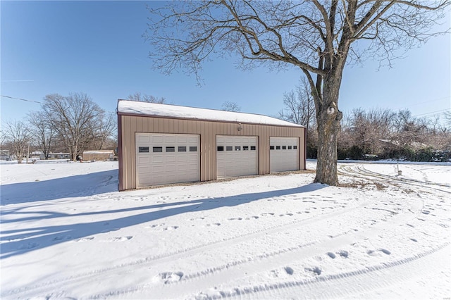 view of snow covered garage