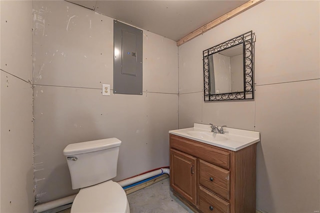 bathroom featuring vanity, electric panel, and toilet