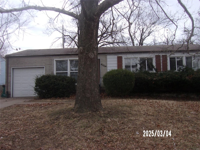 single story home featuring an attached garage